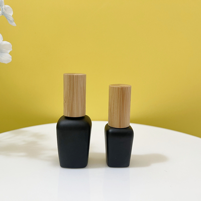 Place colorée de bouteille en verre de clou d'OEM autour de la forme ovale 10ml 12ml 15ml avec le chapeau en bambou